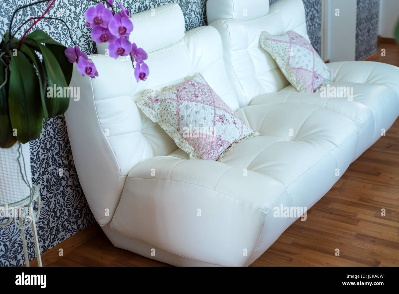 Modern cozy white leather sofa in room Stock Photo Alamy