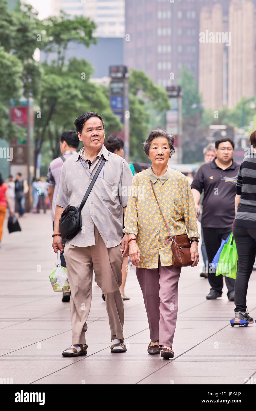 Elderly couple in city center. The population of elderly (60 or older