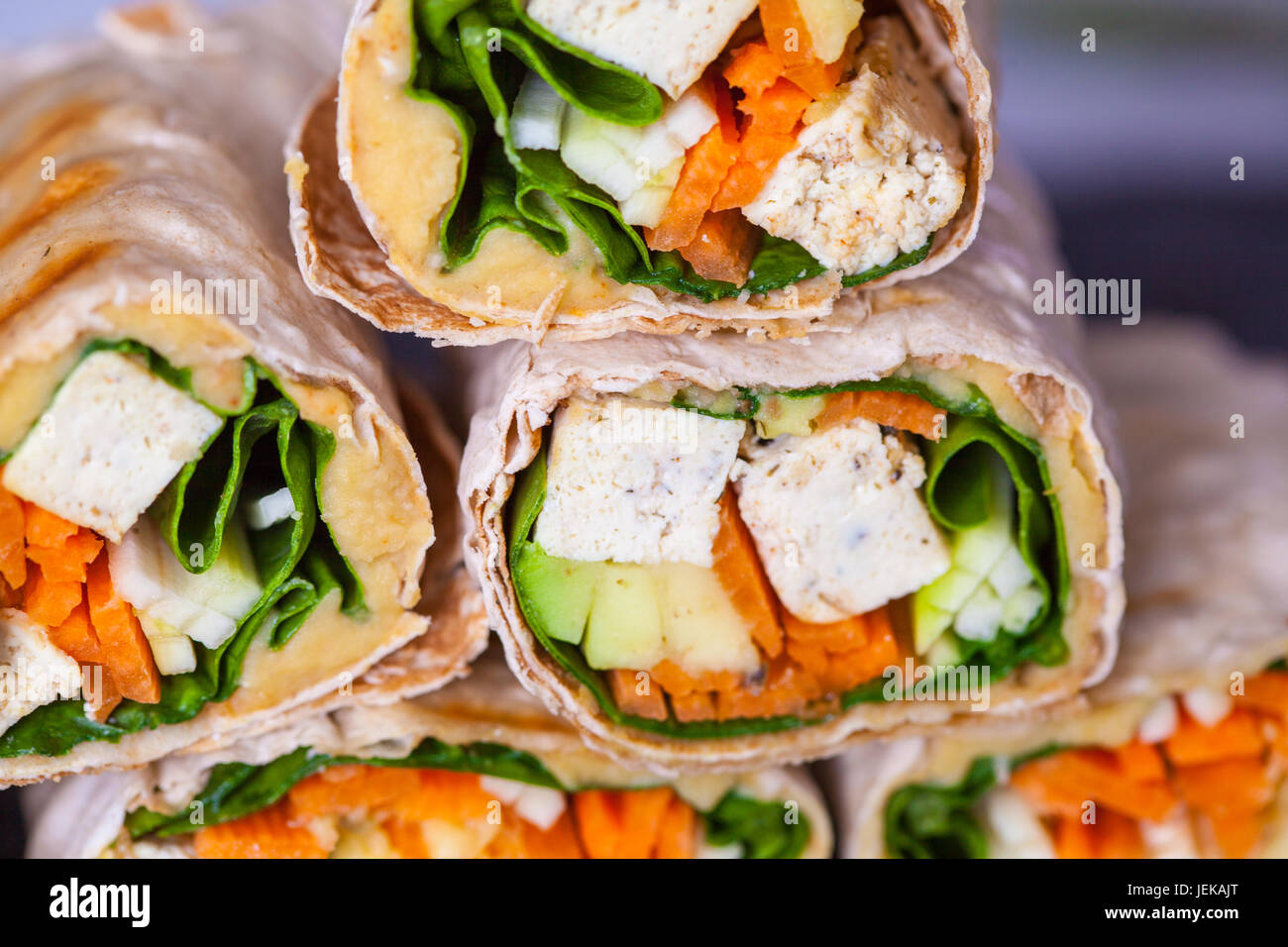 Healthy vegan tofu tortilla wraps with tofu and vegetables. Love for a
