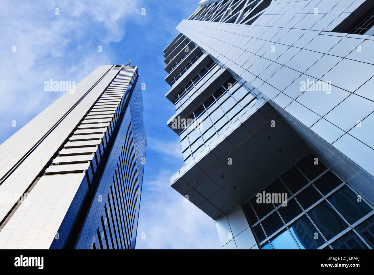 Sharp lines from modern architecture against a blue sky. Stock Photo