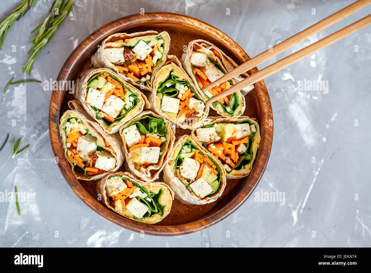 Healthy vegan tofu tortilla wraps with tofu and vegetables, top view