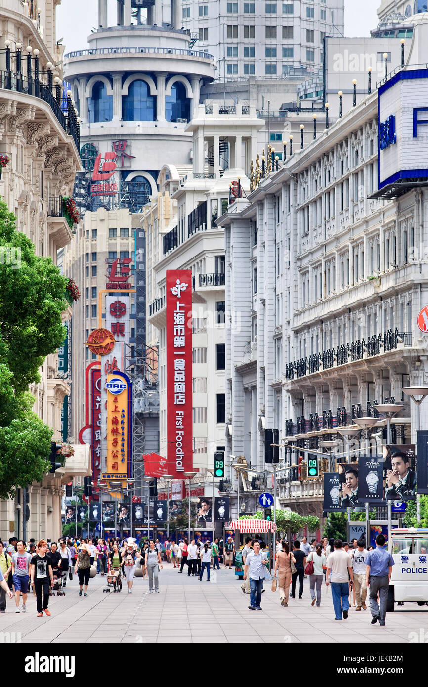 Shoppers in Nanjing East Road. China's 3.4-mile long premier shopping street is a must-see metropolitan destination for fashion-shoppers. Stock Photo