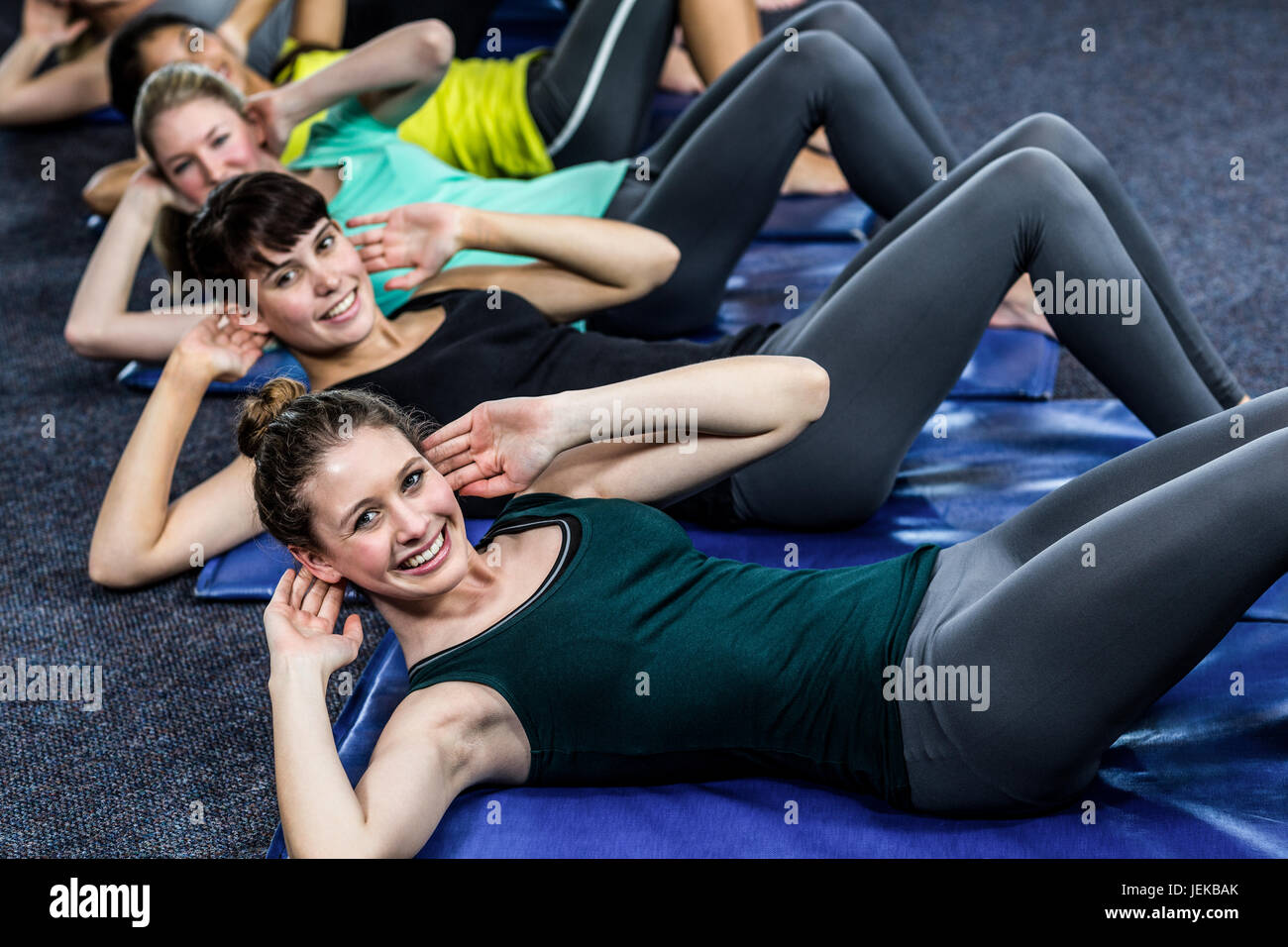 Fit smiling group working abs Stock Photo Alamy