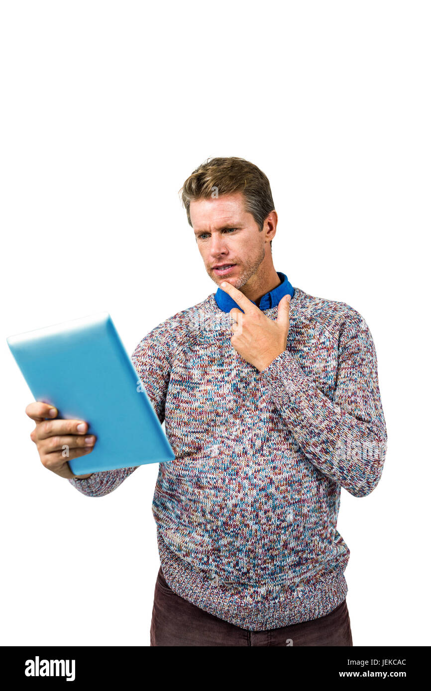 Close-up of confused man reading book Stock Photo - Alamy