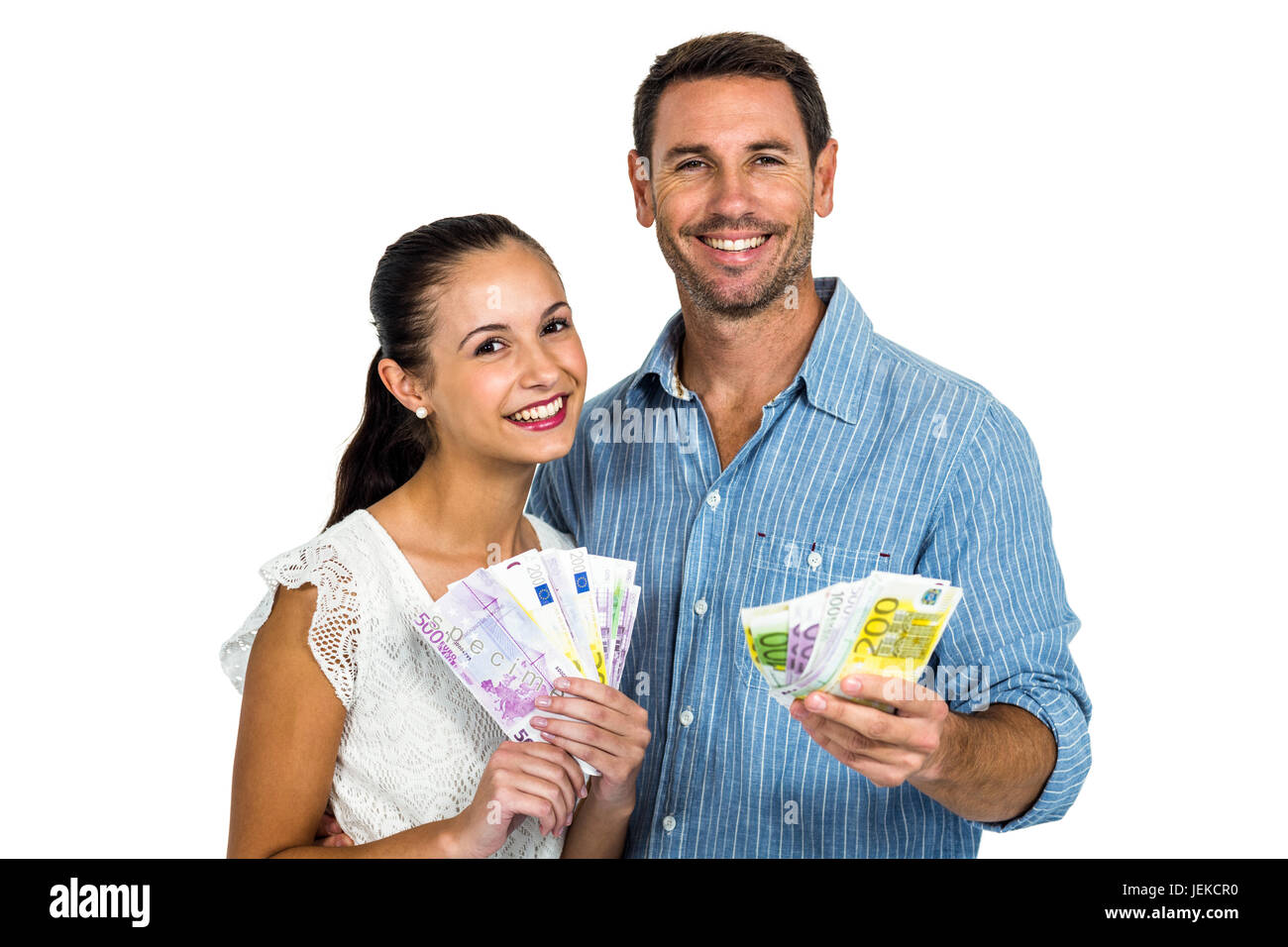 Young couple holding money Stock Photo - Alamy