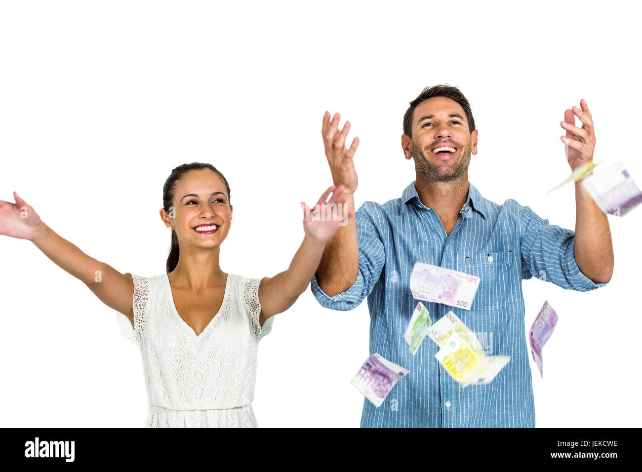 Happy couple throwing money Stock Photo Alamy