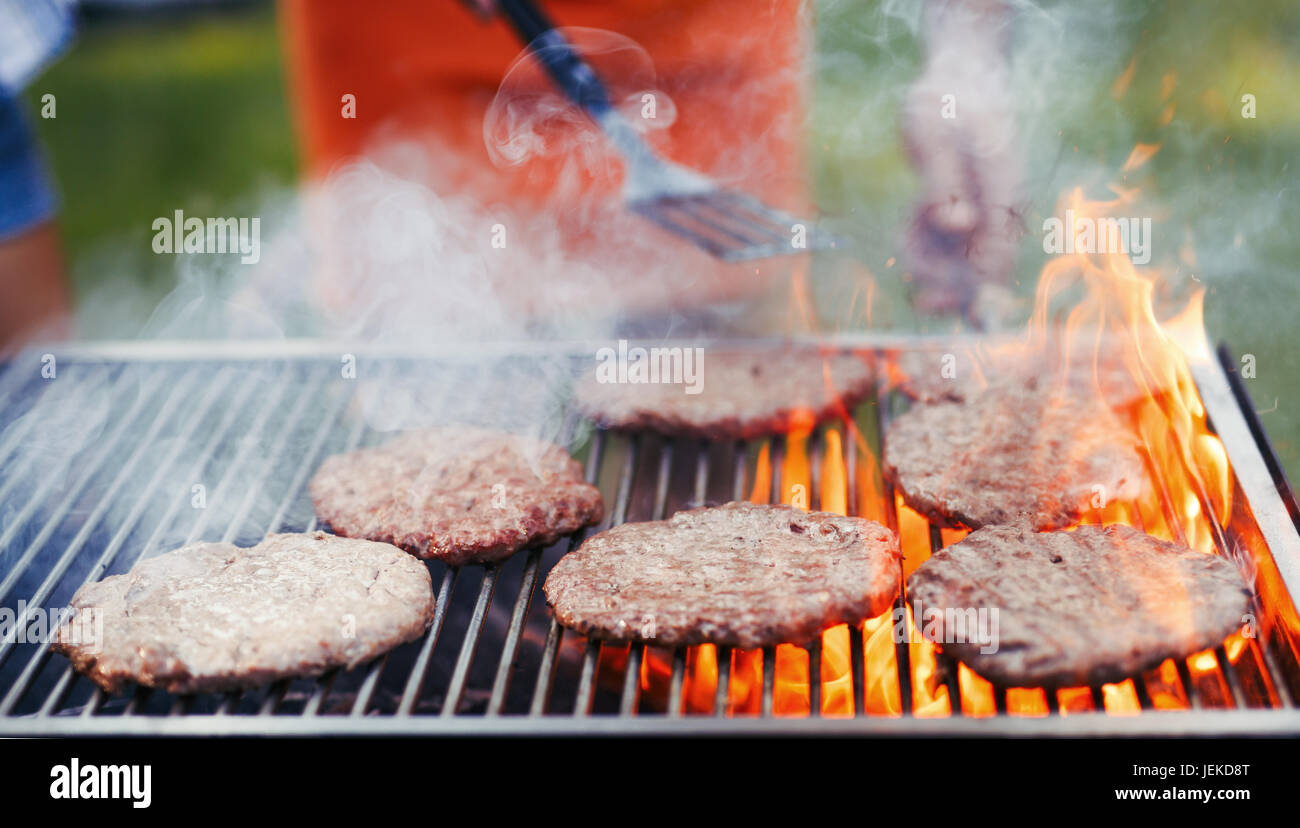 Barbecue beef burgers on flame hi-res stock photography and images - Alamy