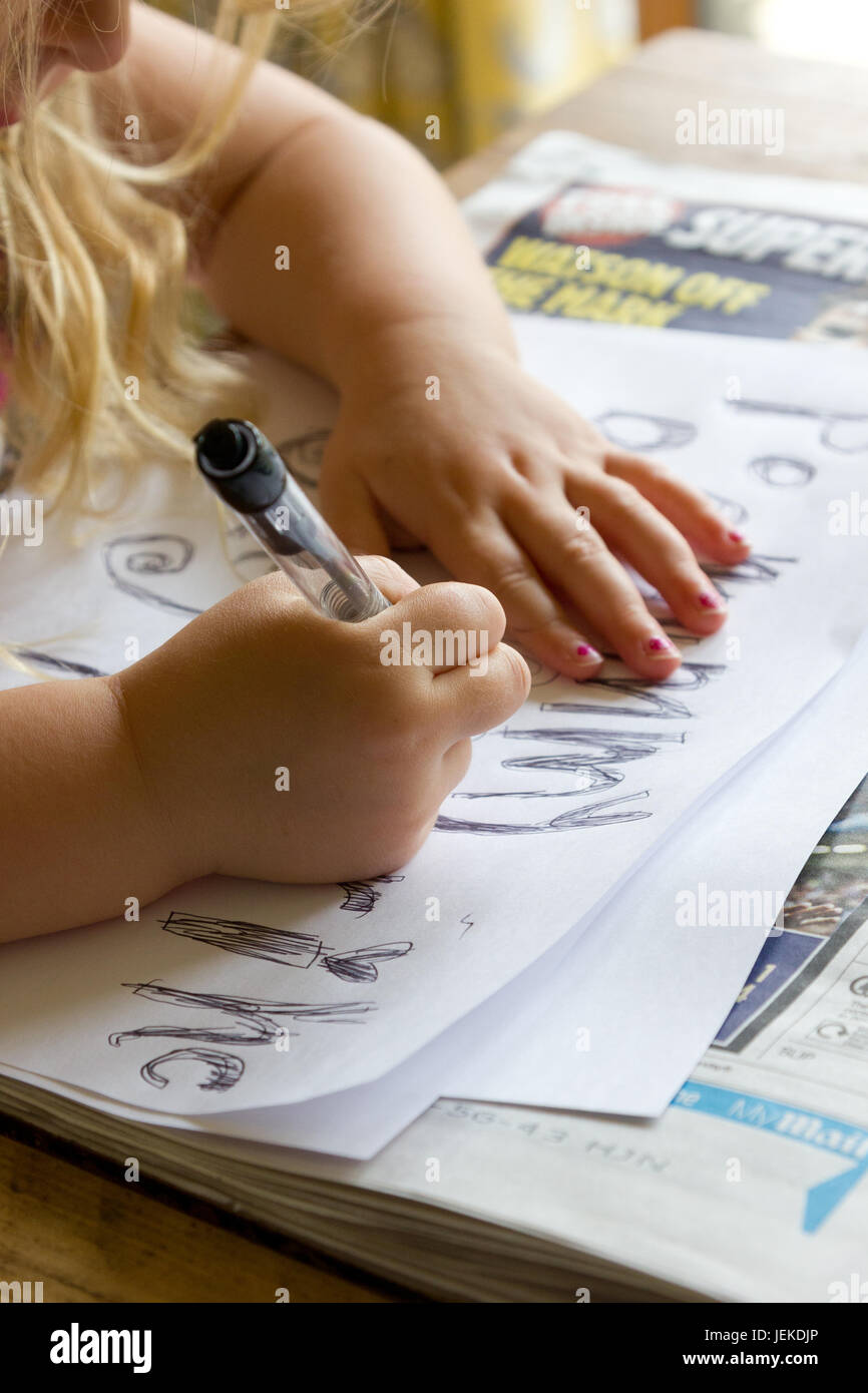 Small child writing Stock Photo