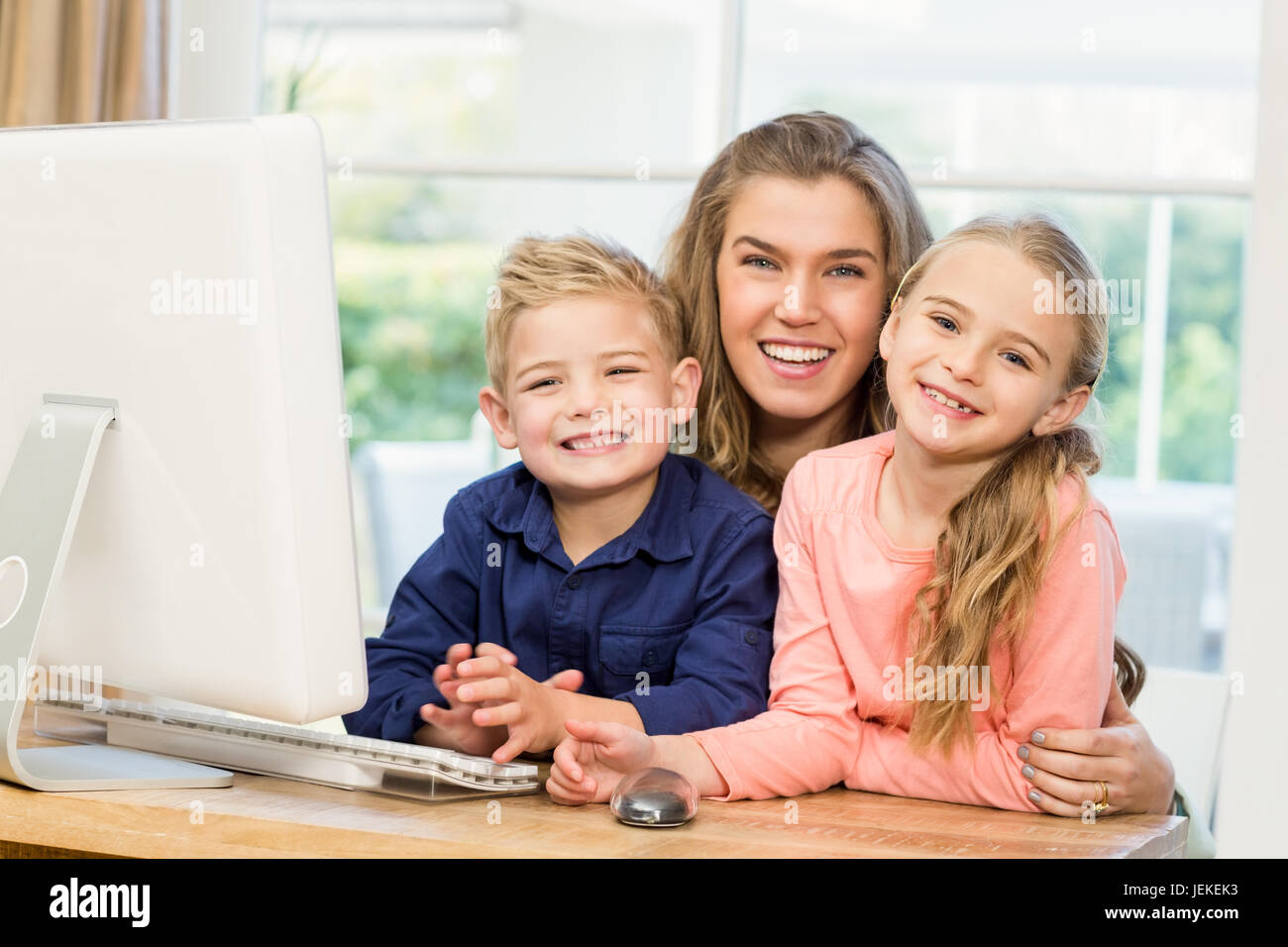 Happy family using the computer Stock Photo - Alamy