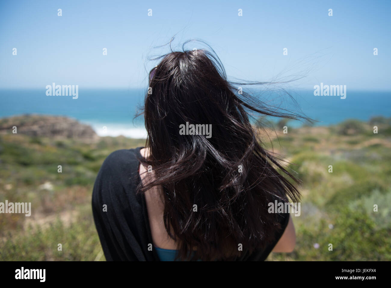 Woman looking up rear view hi-res stock photography and images - Alamy