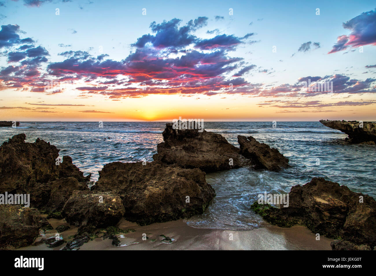 Rocky coastline at sunset, Australia Stock Photo