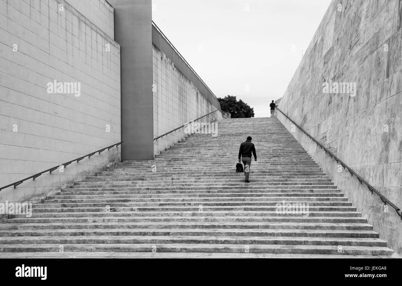 Man walking up steps hi-res stock photography and images - Alamy
