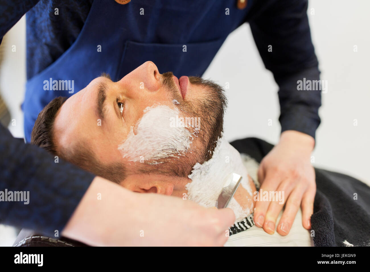 Shaving his beard hires stock photography and images Alamy