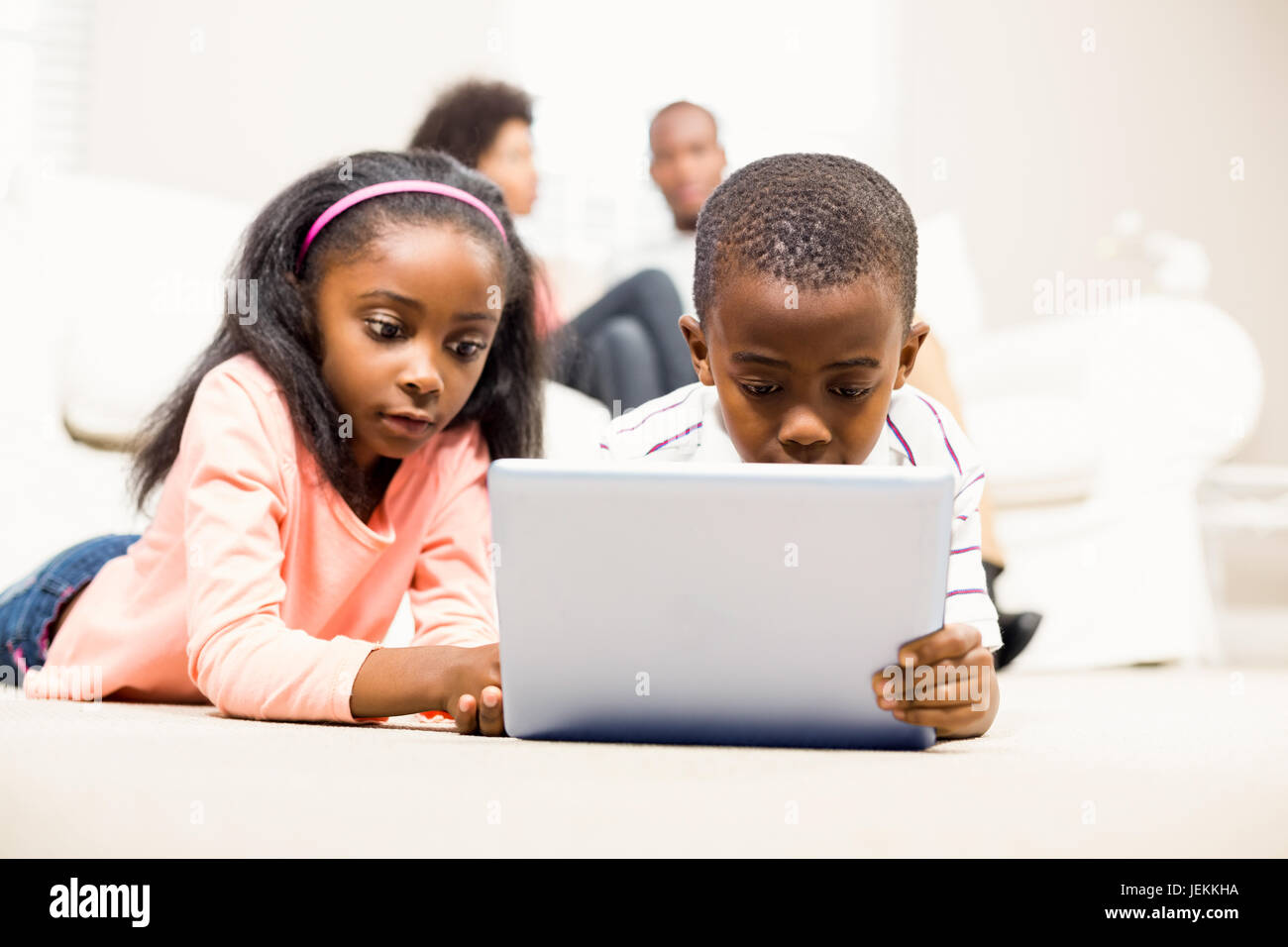 Happy kids using tablet pc Stock Photo Alamy