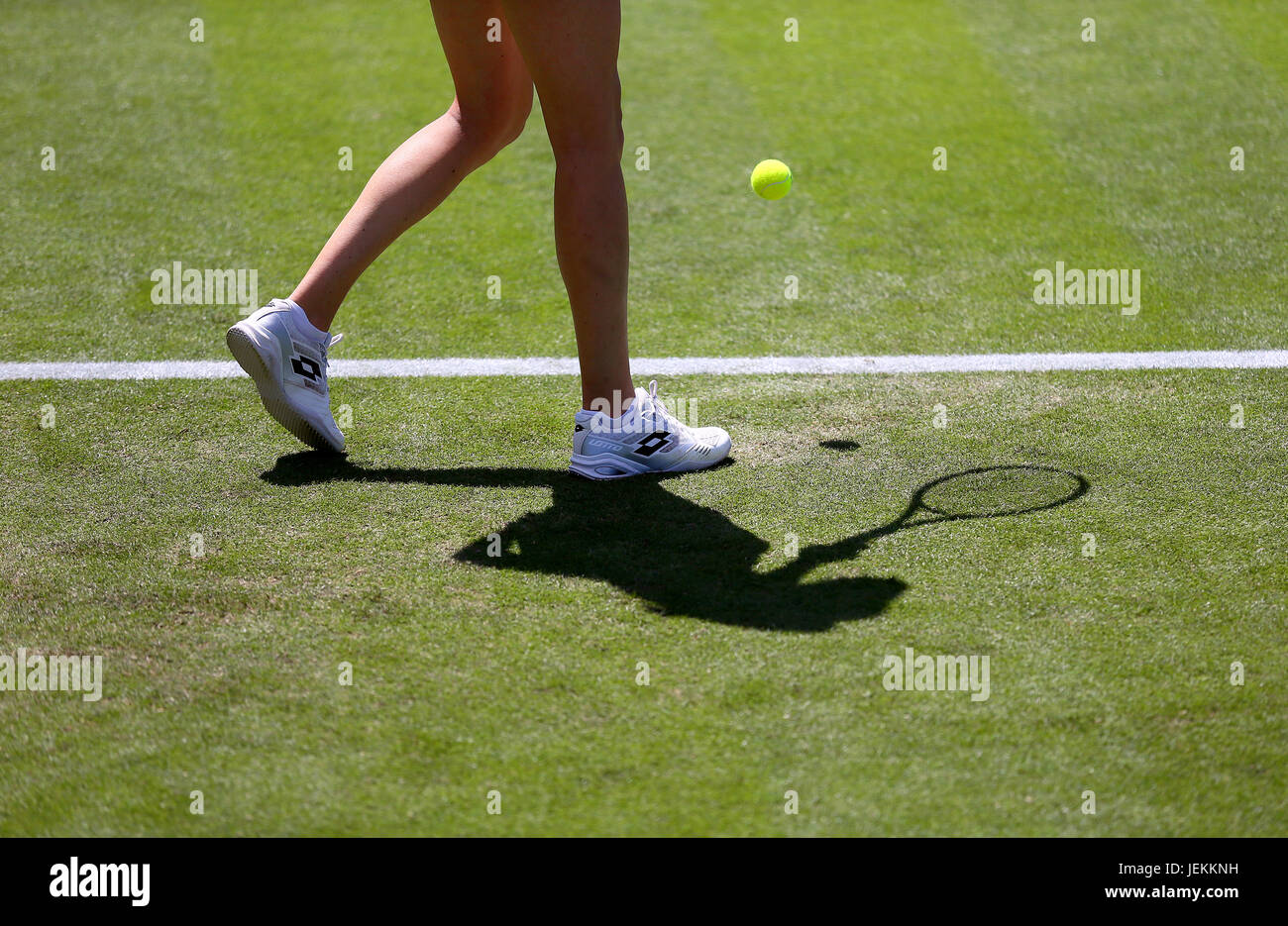 Detail view of Great Britain's Naomi Broady's legs and shoes alongside her shadow during her match against Czech Republic's Kristyna Pliskova during day four of the AEGON International at Devonshire Park, Eastbourne. PRESS ASSOCIATION Photo. Picture date: Monday June 26, 2017. See PA story TENNIS Eastbourne. Photo credit should read: Gareth Fuller/PA Wire. . Stock Photo