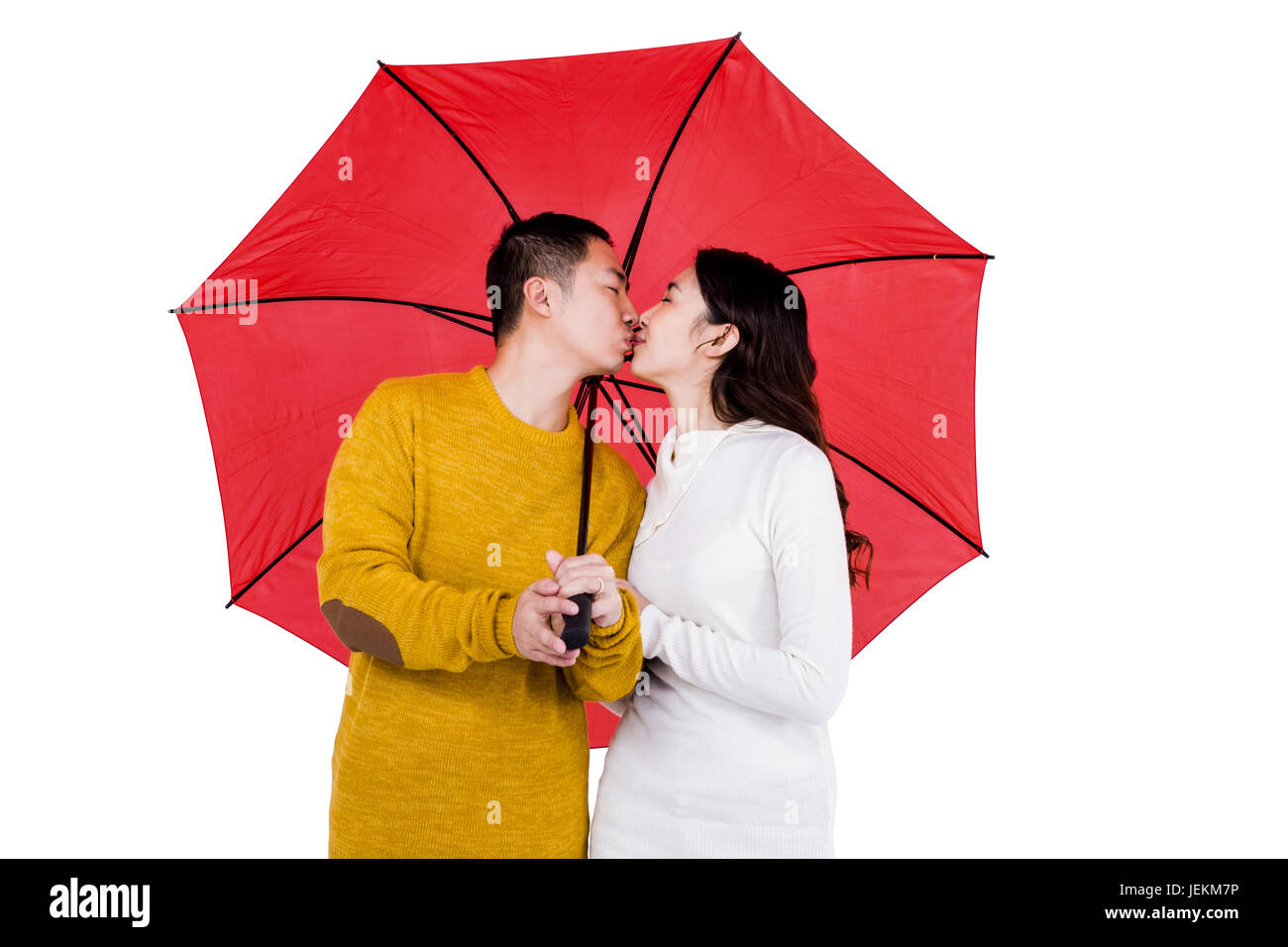 Couple kissing under umbrella Stock Photo Alamy
