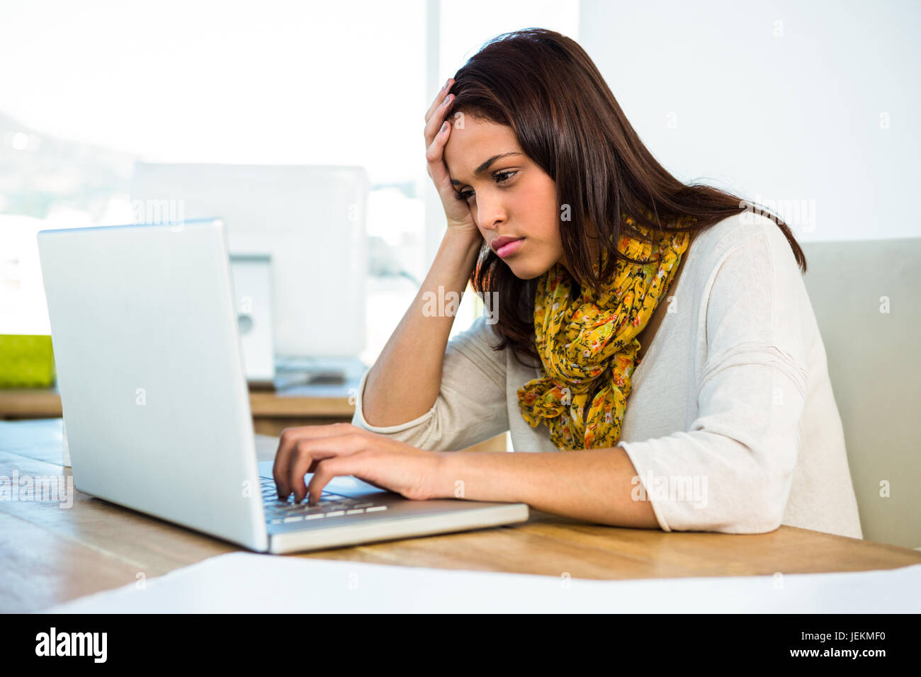 Ye Using A Computer Young girl uses his computer Stock Photo - Alamy