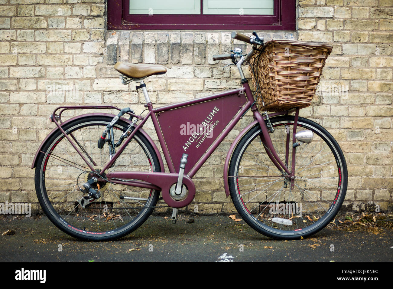 Bike Advertising in Cambridge - a classic style bike advertising the Angel and Blume Interior Design studio in Emmanuel Road, Cambridge UK Stock Photo