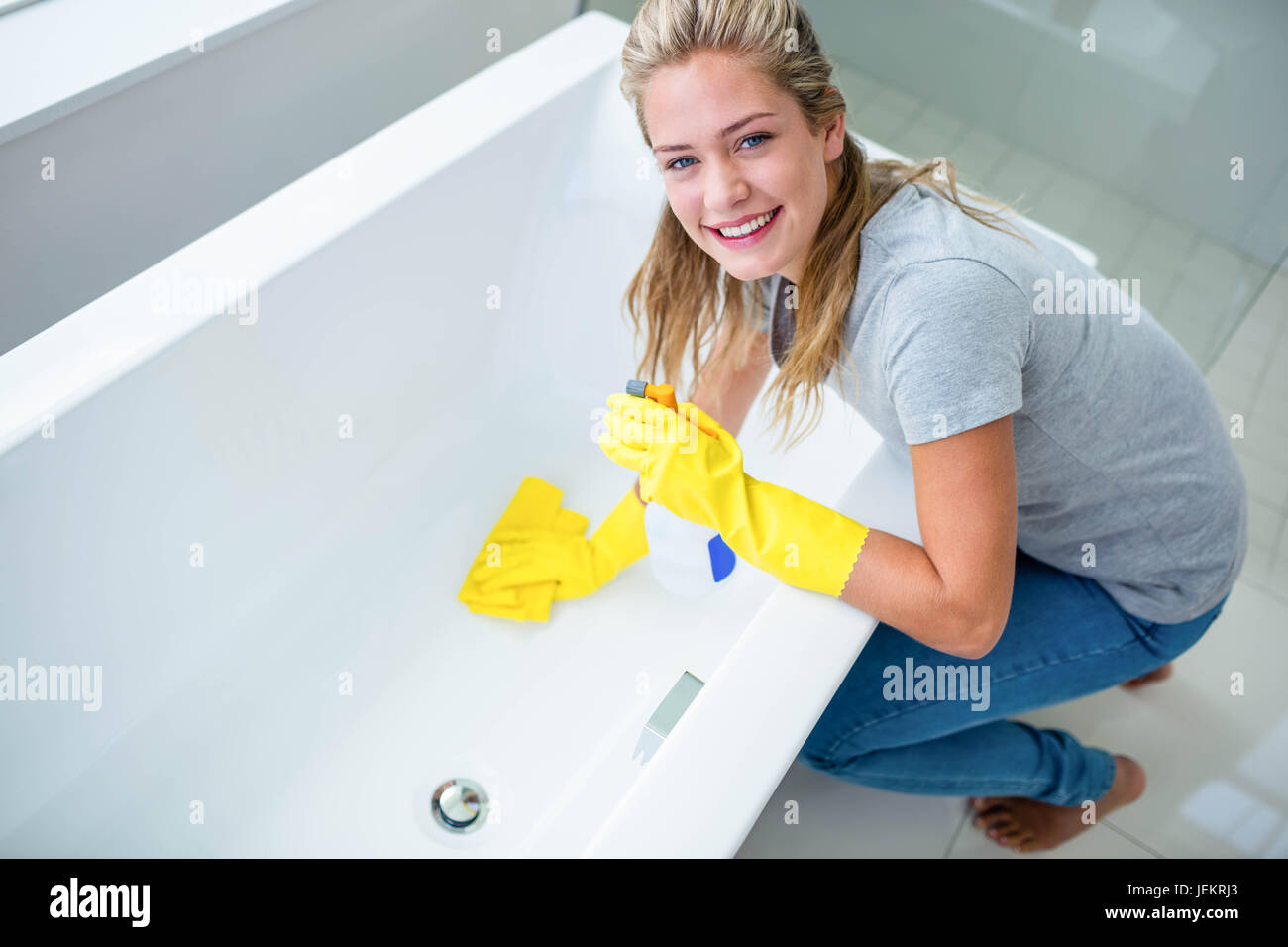 Woman cleaning the bath tub Stock Photo Alamy