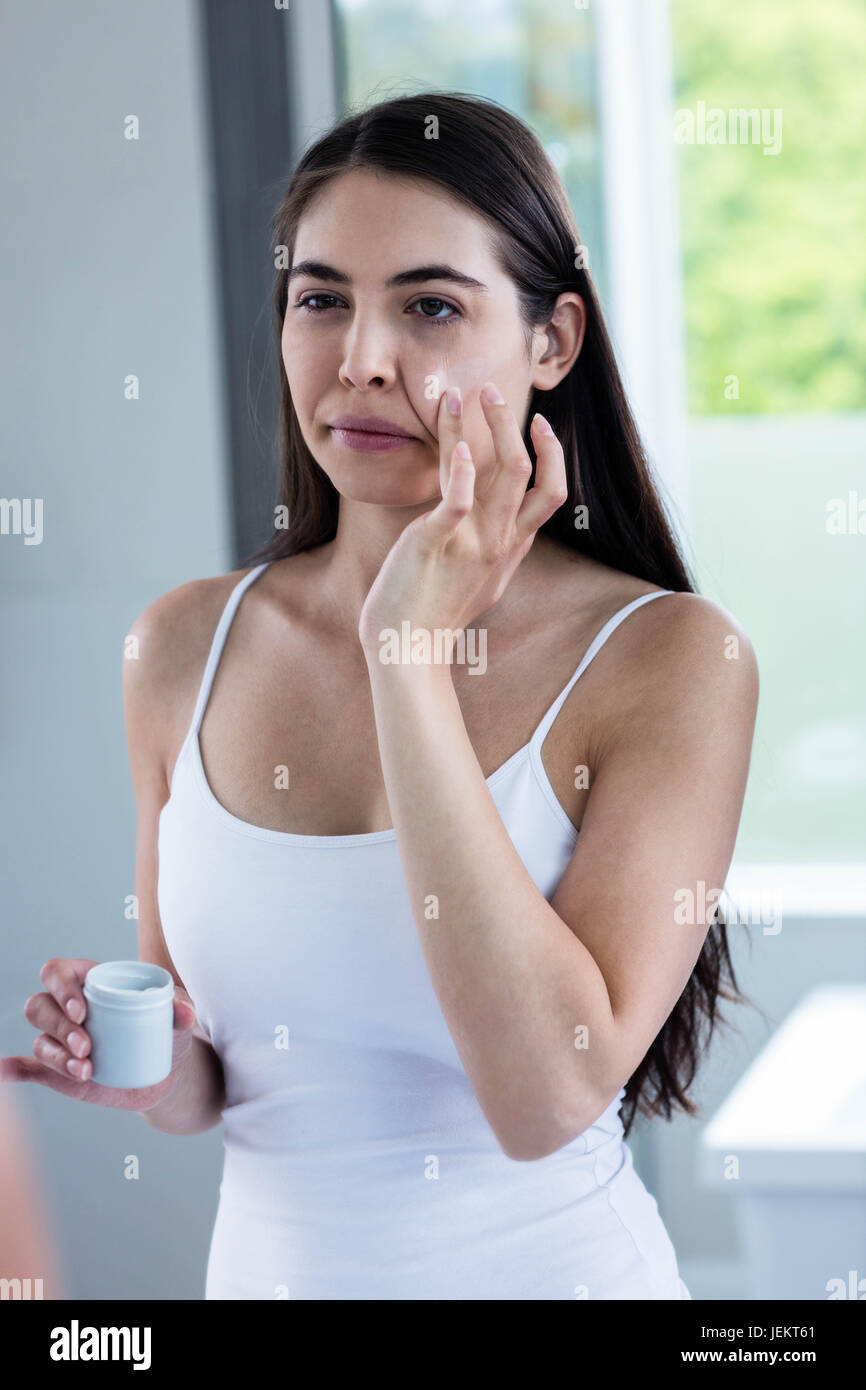 applying face cream Stock Photo Alamy