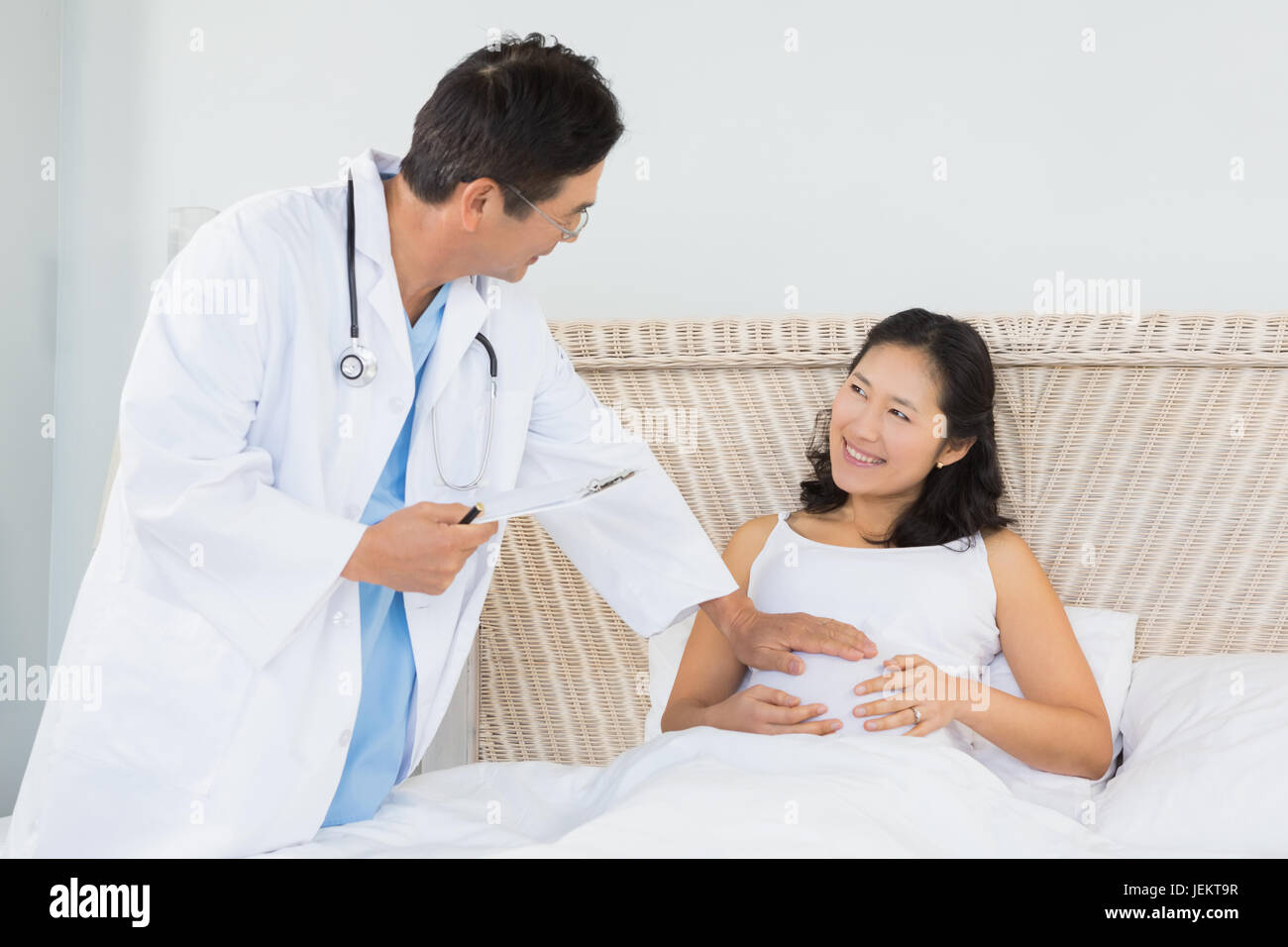 Doctor visiting pregnant woman Stock Photo Alamy