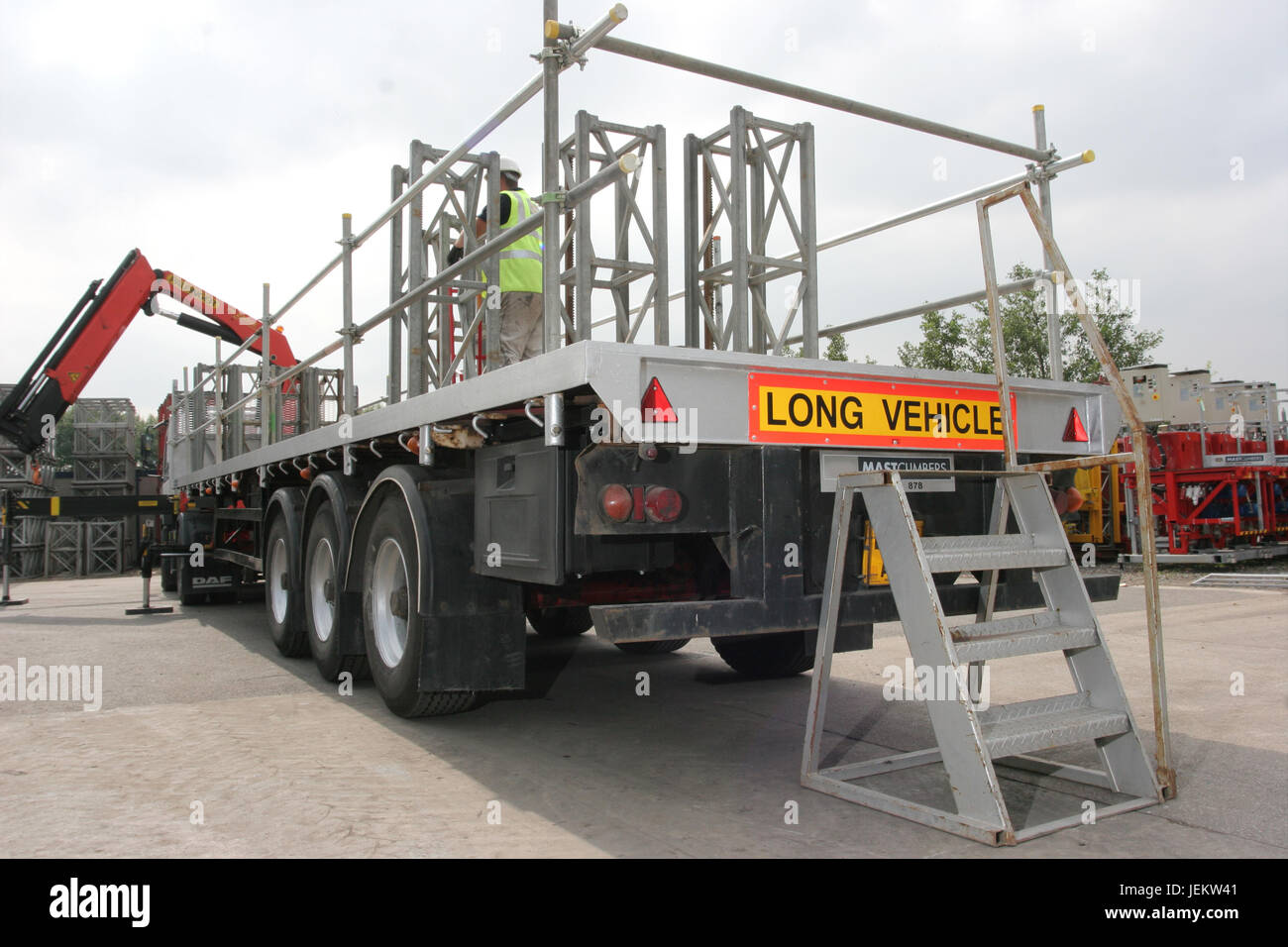 Rear of an HGV trailer in a yard showing safe loading procedures; access steps and guardrails
