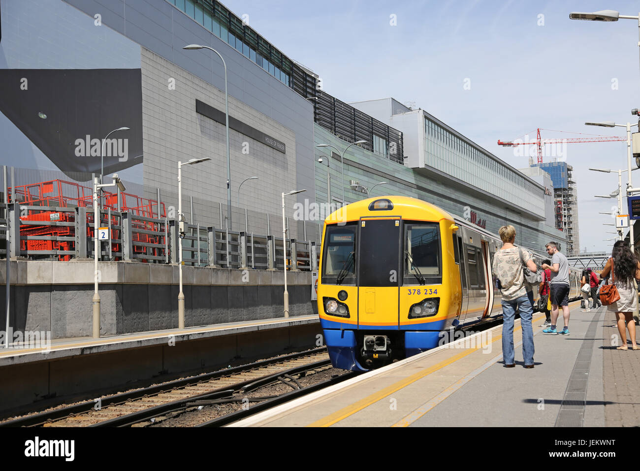 A London Overground train arrives at the newly constructed Shepherds Bush station, next to the Westfield Shopping centre in West London Stock Photo