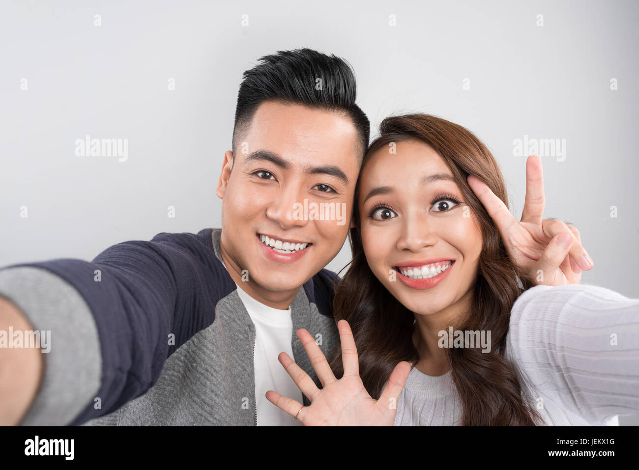 Asian couple making selfie hi-res stock photography and images - Alamy
