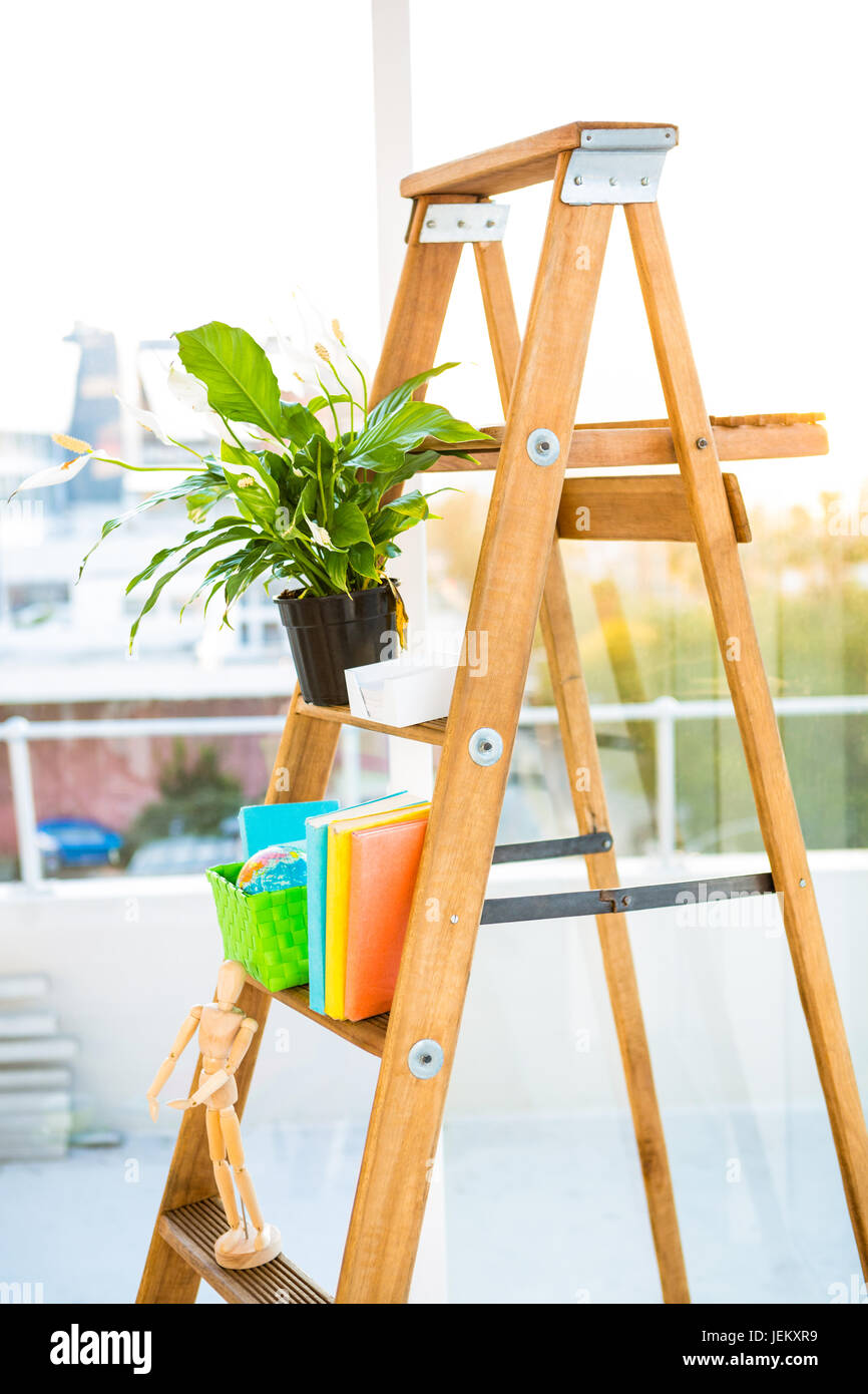 Ladder used as shelf in office Stock Photo Alamy