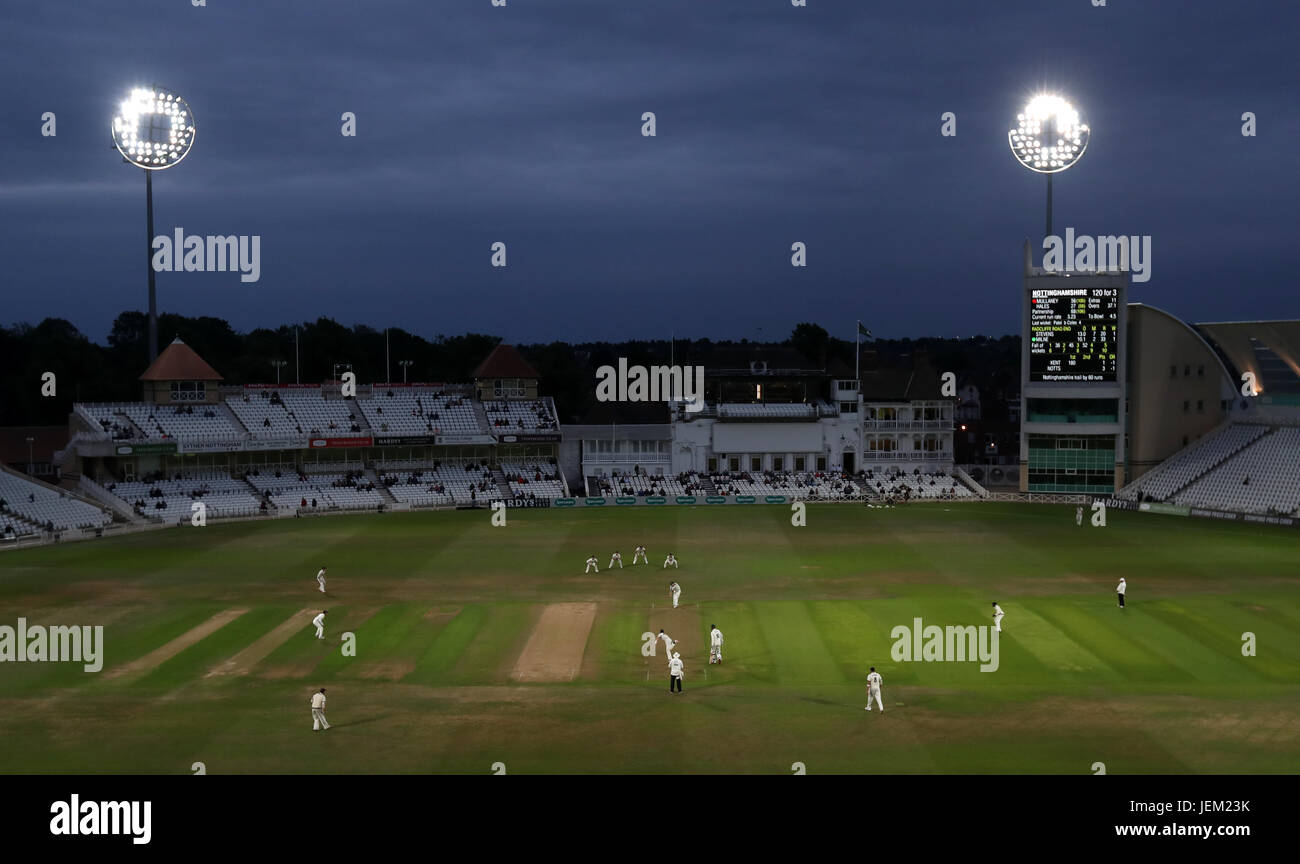 Match action under the floodlights during the Specsavers County Championship, Division Two match at Trent Bridge, Nottingham. Stock Photo