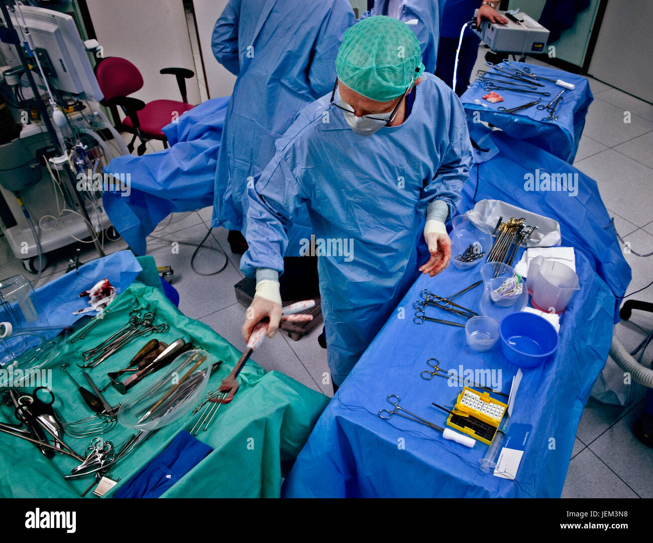 The operating department practitioner (ODP) ensures all instruments and equipment are available within the sterile area. Stock Photo