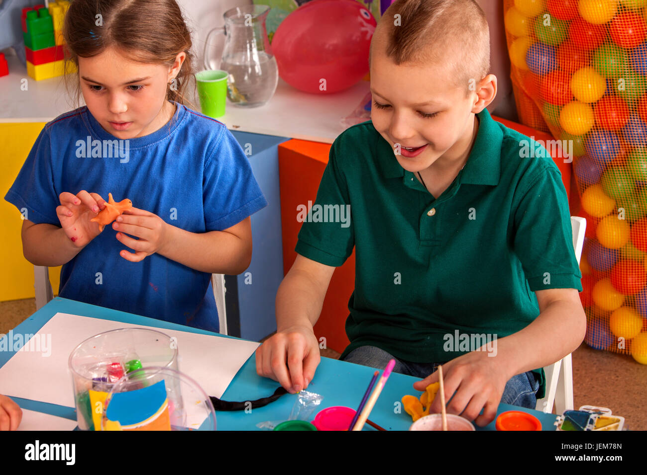 Plasticine modeling clay in children class. Clay projects teacher school.  Stock Photo by ©poznyakov 219325378