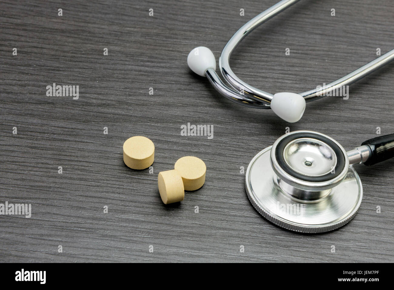 Phonendoscope and pills, healtcare concept Stock Photo