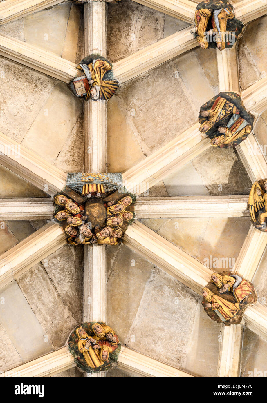 Painted stone boss on the ceiling of the nave of Norwich cathedral depicting the disciples of Jesus witness his ascension into heaven. Stock Photo