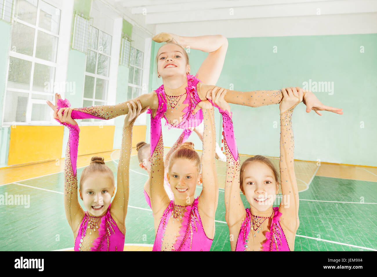 Happy girls doing routine in rhythmic gymnastics Stock Photo