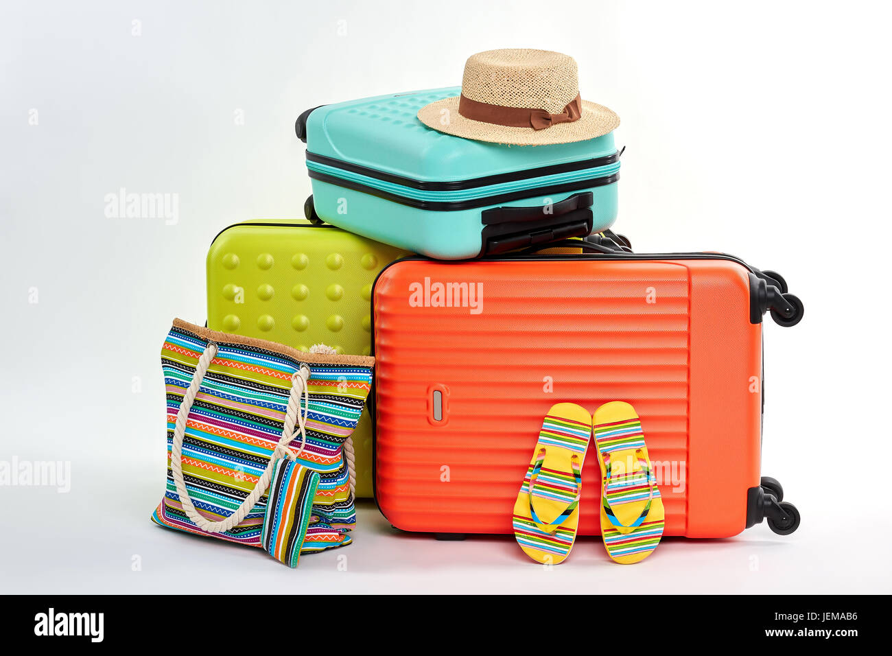 Female flips and handbag, suitcases. Accessories for beach resort. Stock Photo