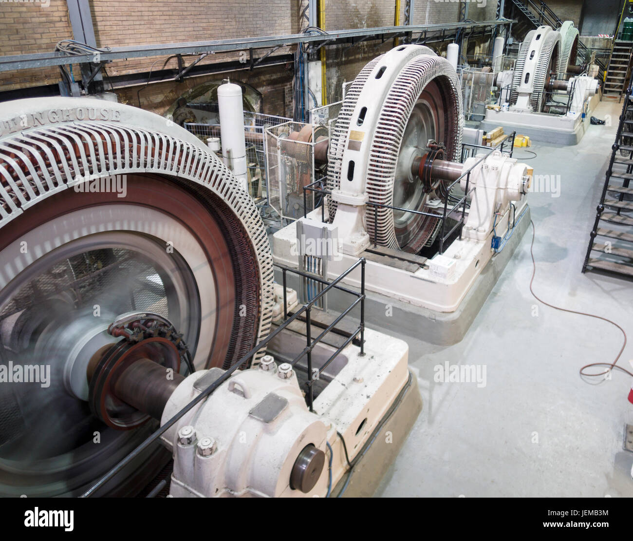 Four Spinning Hydro Electric Turbines: A row of four small old Stock Photo: 146735896 ...
