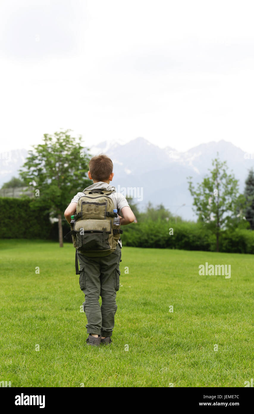 Boy with a backpack ready for adventure and travel Stock Photo - Alamy