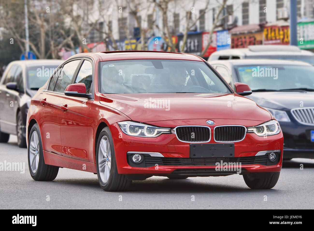 BMW 3 series on the road. BMW sales will be hit in 2016 by strong competition, slowing Chinese economy and crackdown on conspicuous consumption. Stock Photo