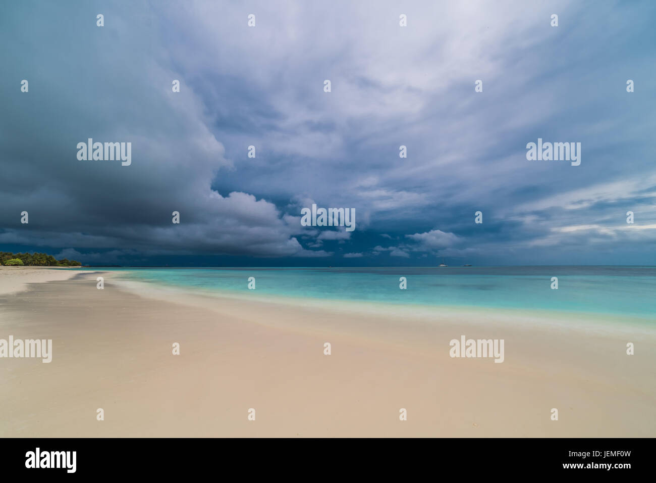 Moody sky and beach, long exposure. Abstract beach background. Dramatic waves and sky Stock Photo