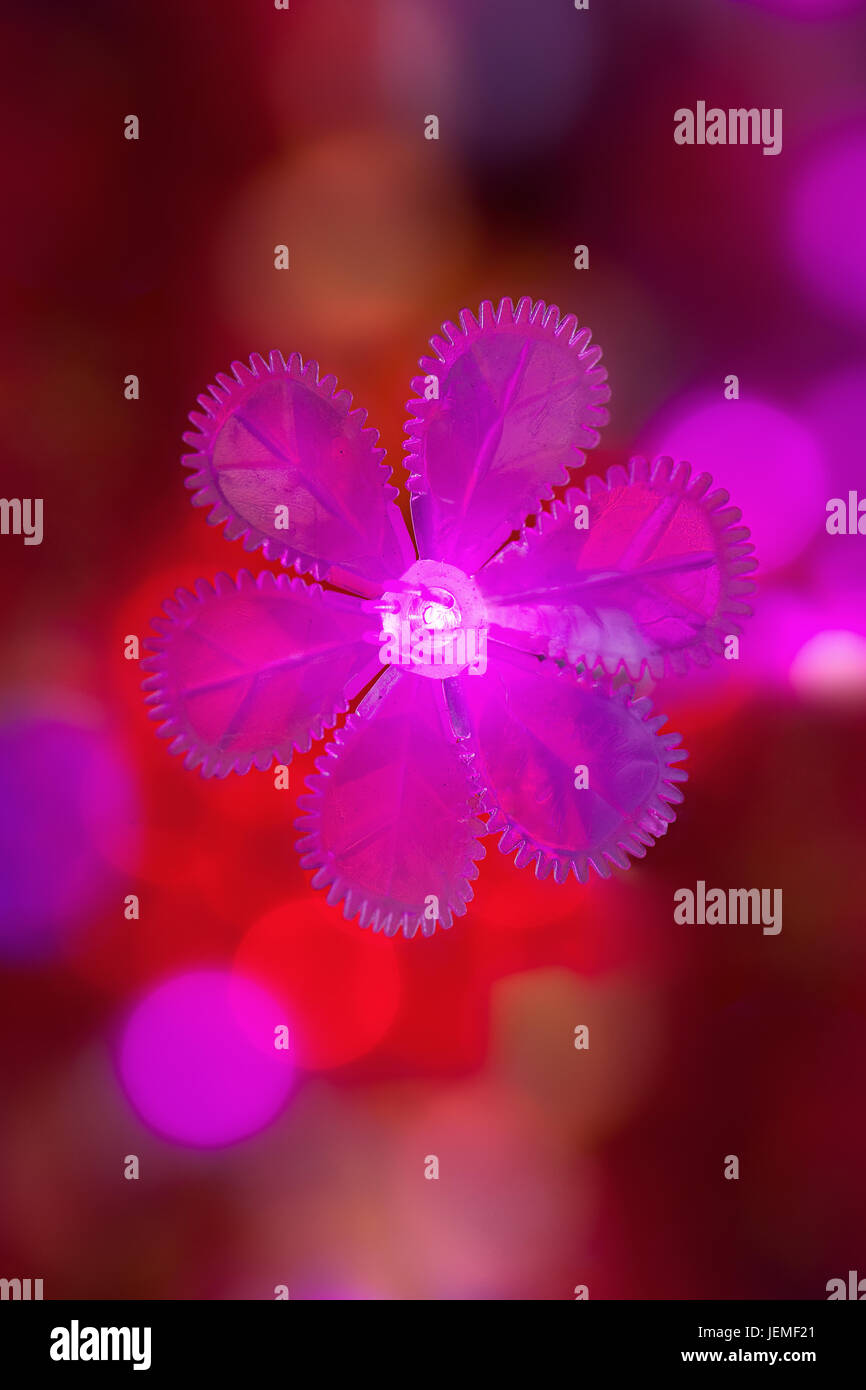 Flower shaped light in red colored environment Stock Photo Alamy
