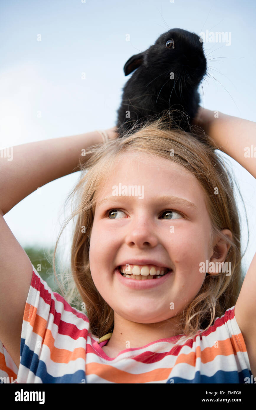 Girl with pet rabbit, close-up Stock Photo - Alamy
