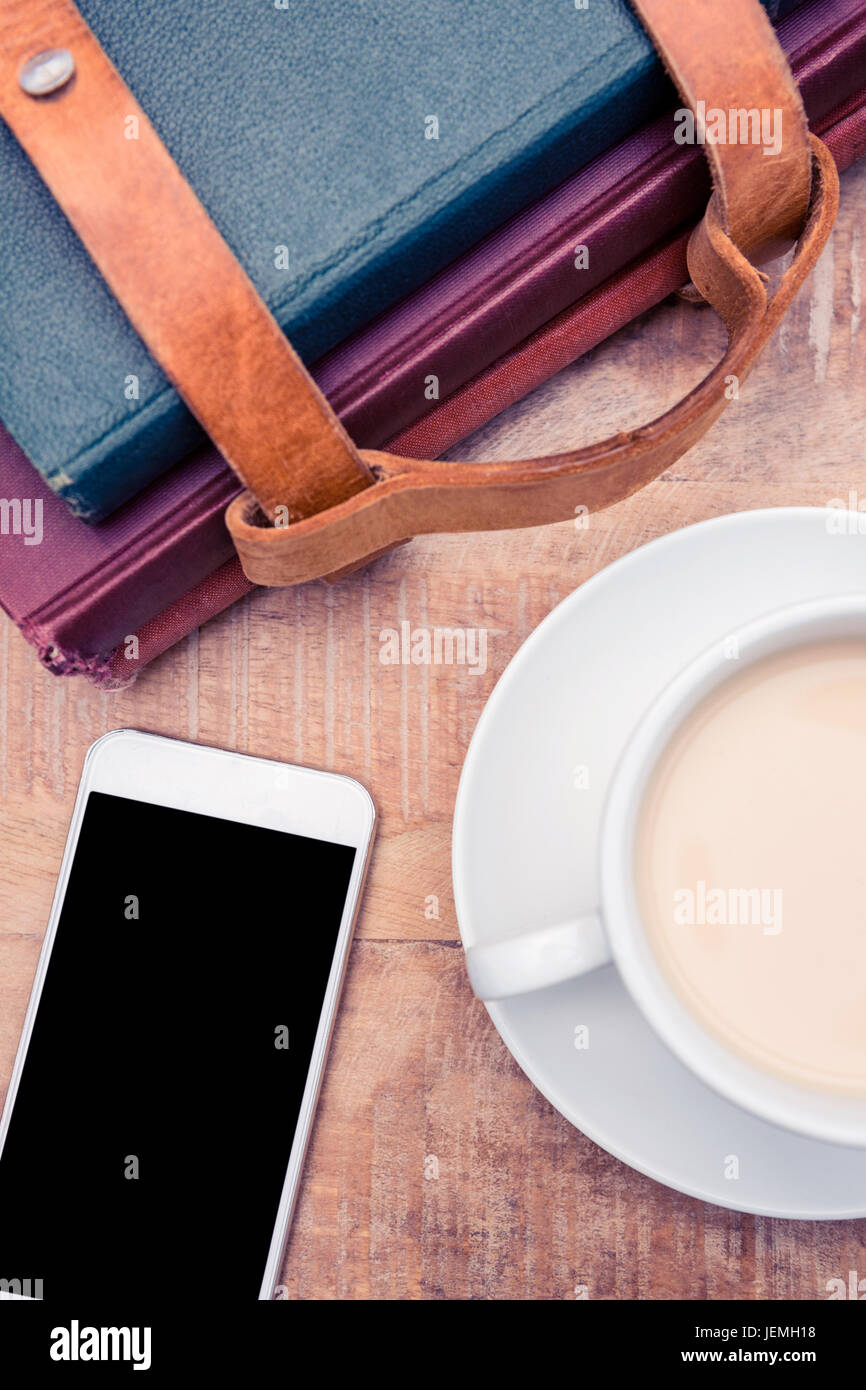 Smartphone with coffee and diaries Stock Photo