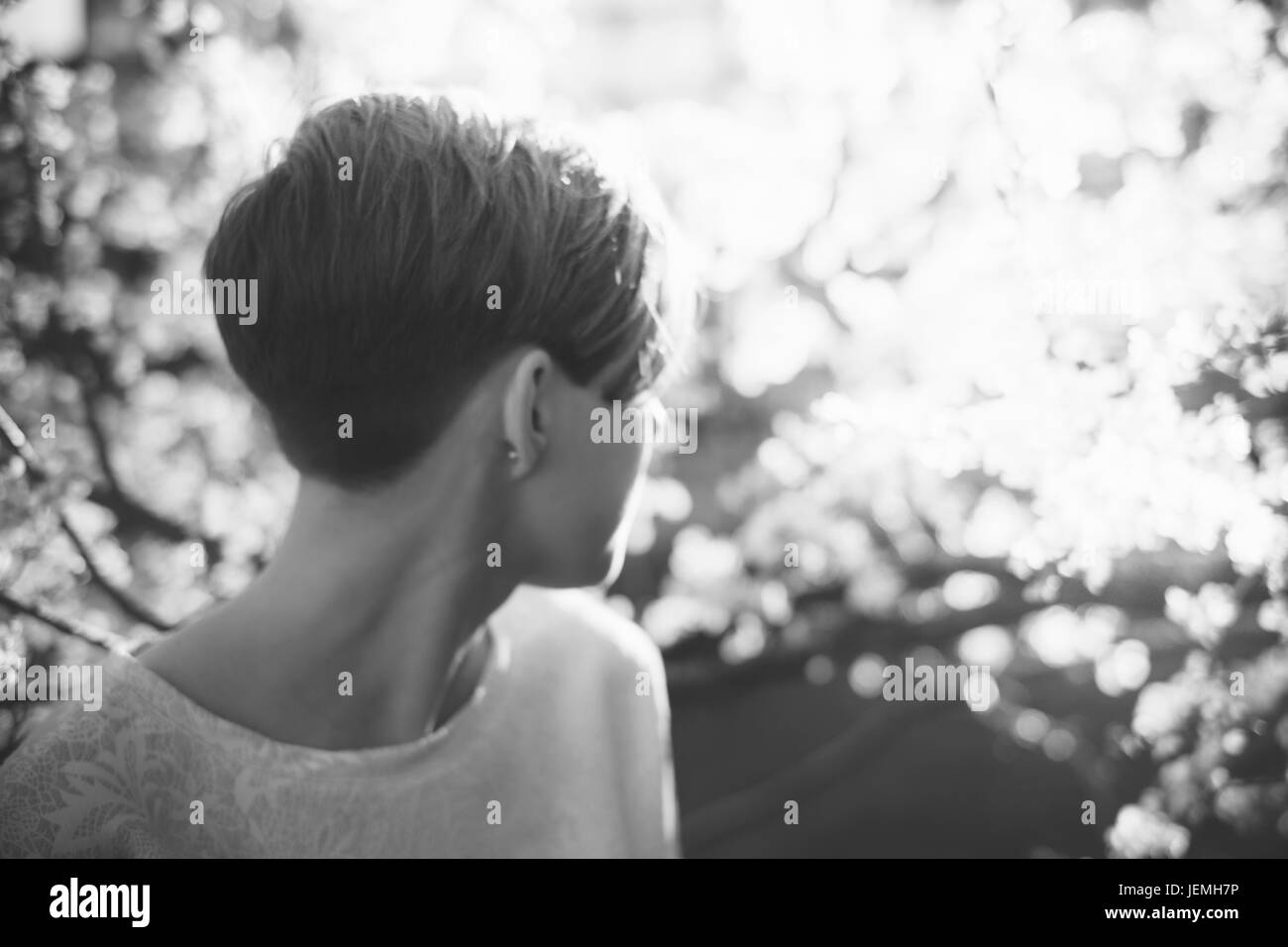 Young woman looking away Stock Photo - Alamy