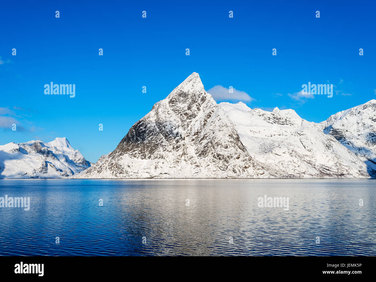 Mount Olstind reflected in the calm waters of Reinefjord on the Lofoten Islands Stock Photo