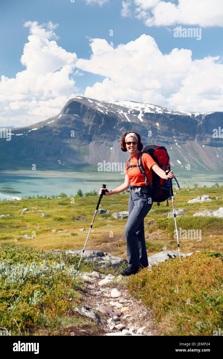 Woman hiking in mountains Stock Photo - Alamy