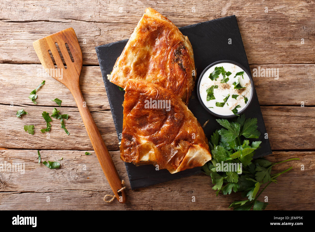 Tasty Turkish burek with spinach and cheese close-up on table. horizontal view from above Stock Photo