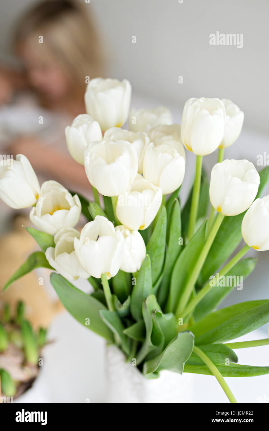 White tulips in focus people hi-res stock photography and images - Alamy