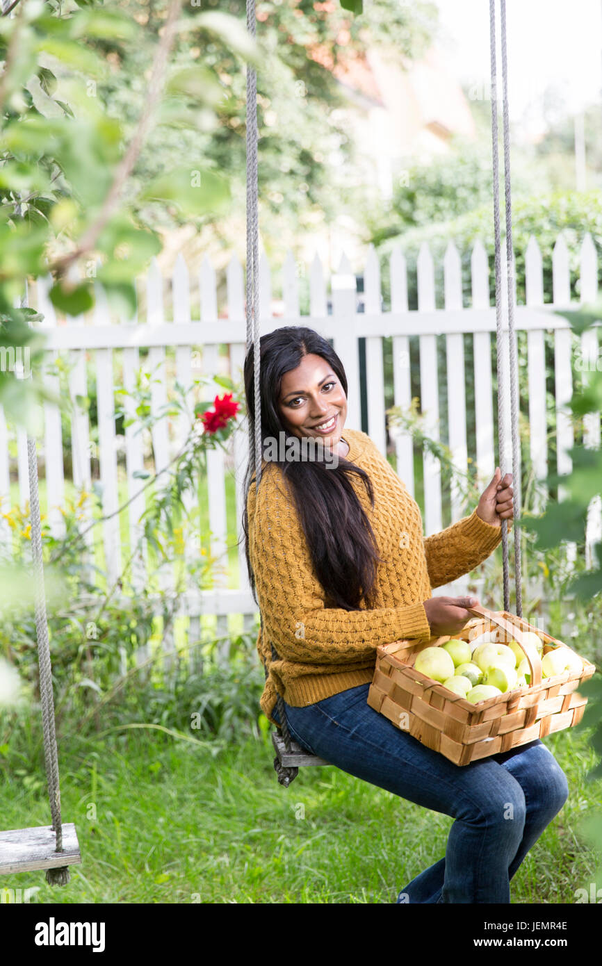 Woman on swing hi-res stock photography and images - Alamy