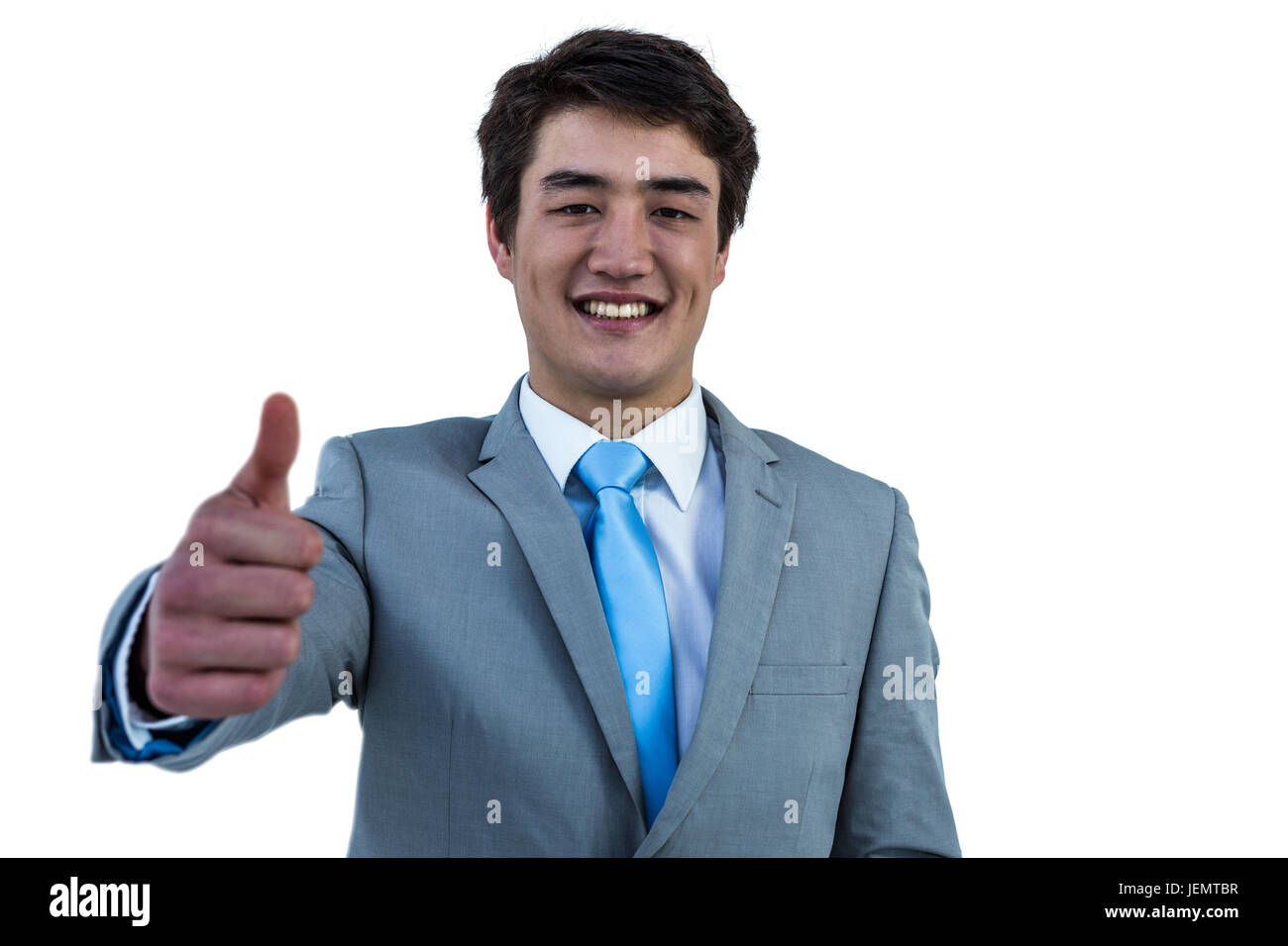 Smiling asian businessman showing thumbs up Stock Photo